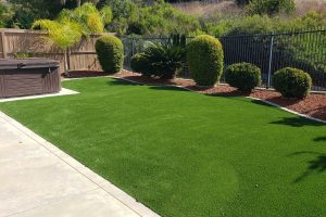 Residential backyard with artificial grass landscaping